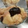 Vegan icecream topped with silver pearls and syrup