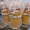 Stack of yellow corn tortillas wrapped in clear plastic.