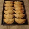 Tray of baked flour empanadas