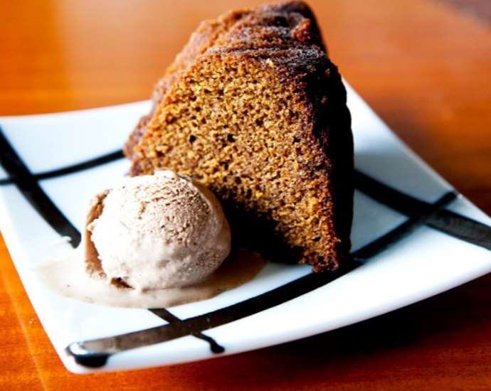 A brownie cake served with ice cream