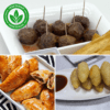 Three plates of Indonesian snacks including meatballs, spring rolls, and fried bananas.
