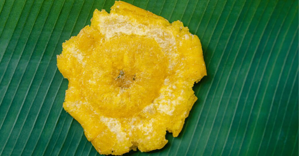 Golden fried pastries with cherry filling oozing out.
