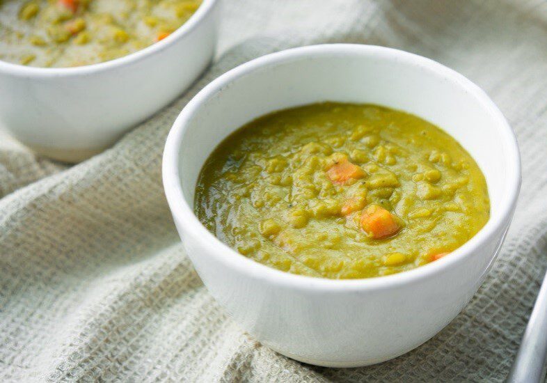 Split pea soup served in a glass bowl