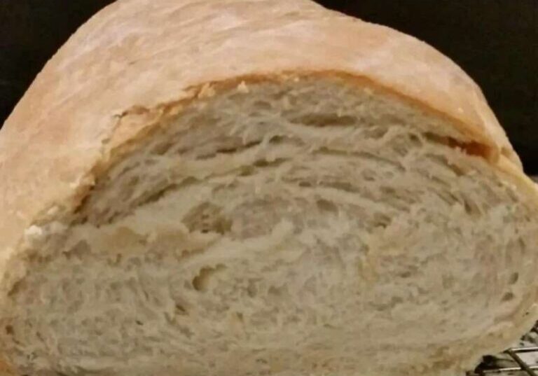 Close up shot of bread with a large cut